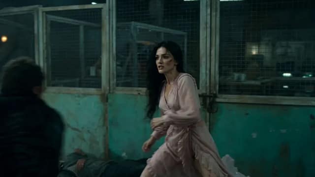 A cinematic, high-intensity fight sequence in a dark, gritty industrial warehous